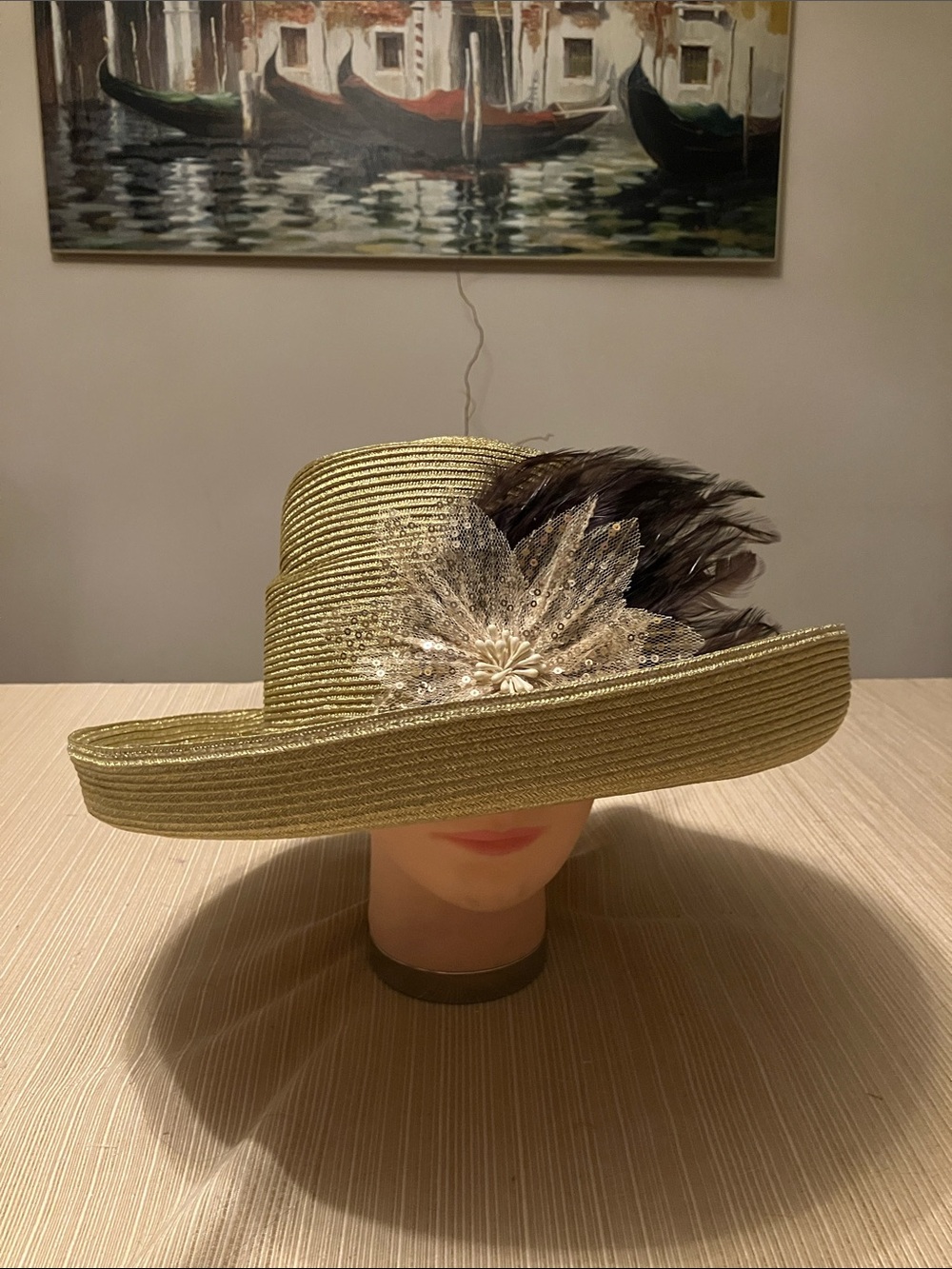 Elegant Metallic Gold Hat with Brown Feather & Sequin Floral Accent